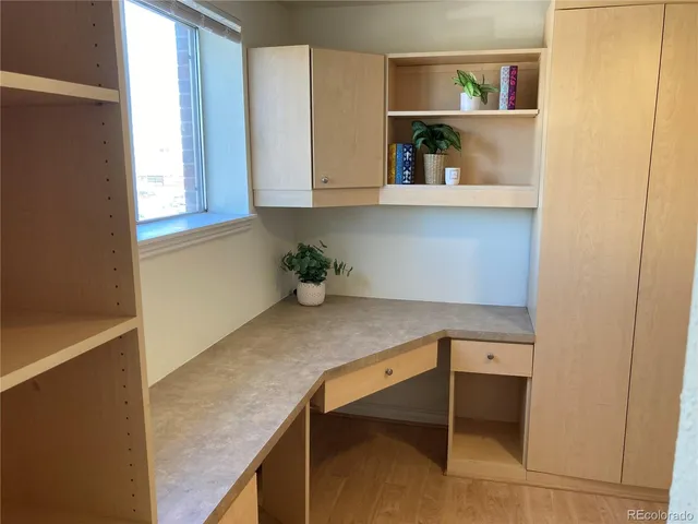 a view of walk in closet with empty racks