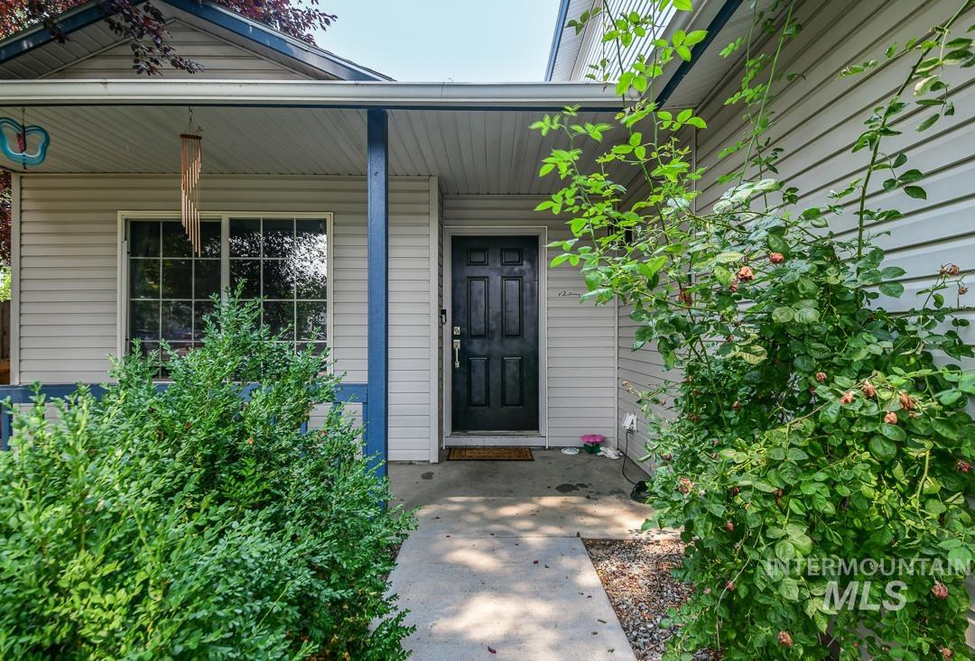 805 Bison Way Caldwell, ID 83607 - Photo 5 of 45 Covered front entry with a dark-paneled door
