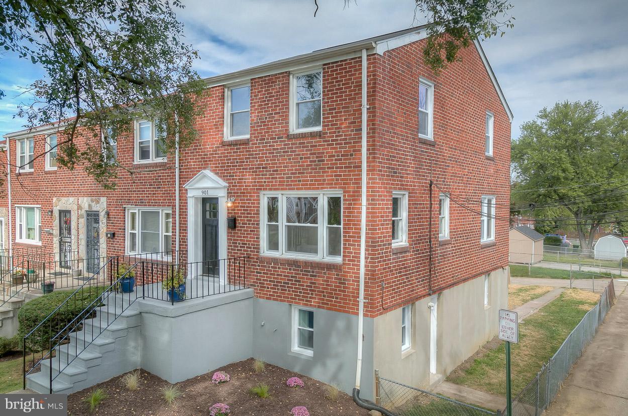 901 Stamford Road Baltimore, MD 21229 - Photo 2 of 27 a front view of a house with a yard