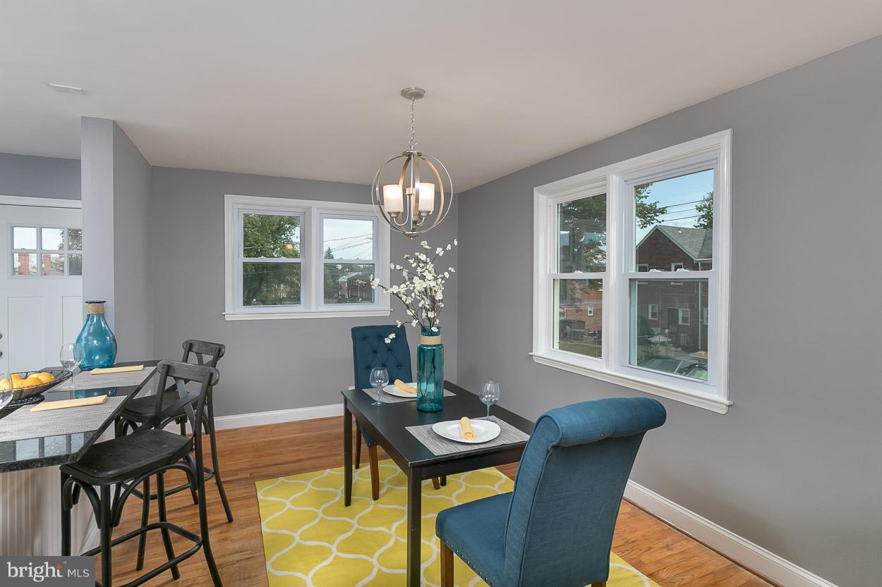 901 Stamford Road Baltimore, MD 21229 - Photo 13 of 27 a view of a dining room with furniture and chandelier