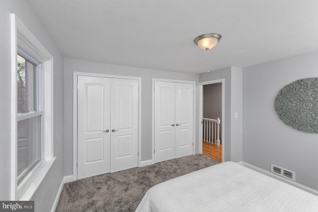 901 Stamford Road Baltimore, MD 21229 - Photo 17 of 27 a bedroom with a bed and a window