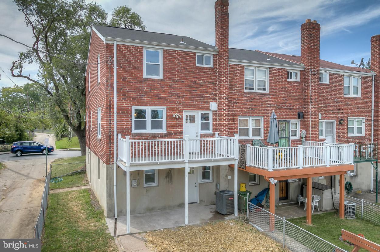 901 Stamford Road Baltimore, MD 21229 - Photo 3 of 27 a front view of a building with a garden