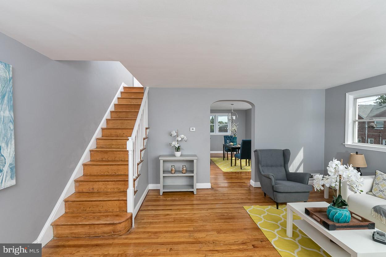 901 Stamford Road Baltimore, MD 21229 - Photo 6 of 27 a living room with furniture and a wooden floor
