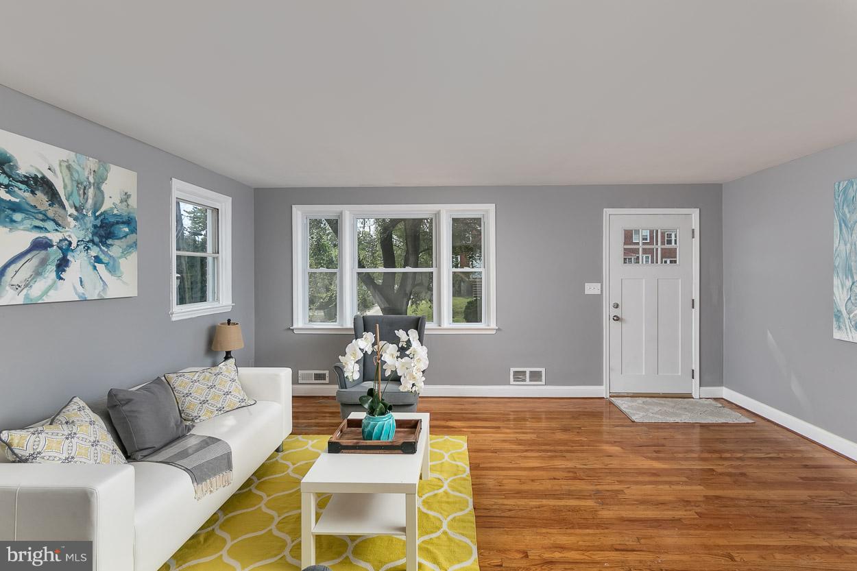 901 Stamford Road Baltimore, MD 21229 - Photo 9 of 27 a living room with furniture window and wooden floor