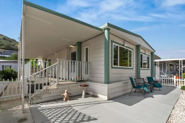 a view of house with outdoor seating