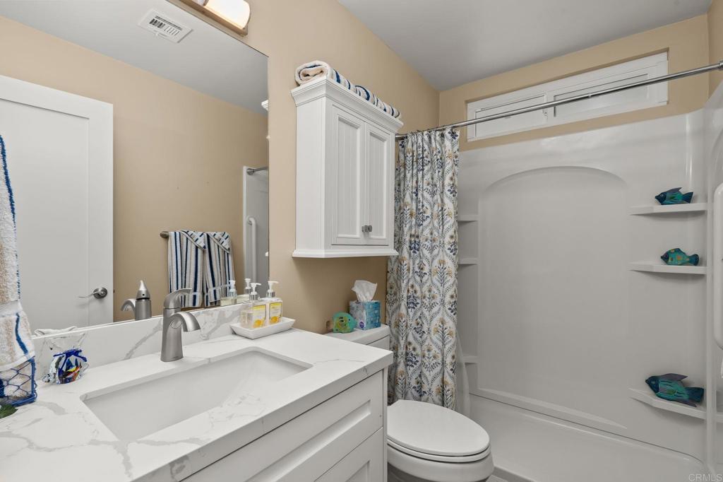 7467 Mission Gorge Road, Unit 104 Santee, CA 92071 - Photo 19 of 25 a bathroom with a sink toilet and shower