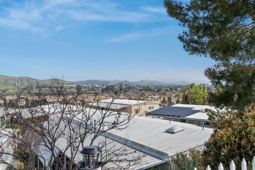 7467 Mission Gorge Road, Unit 104 Santee, CA 92071 - Photo 2 of 25 a view of a terrace with furniture and city view