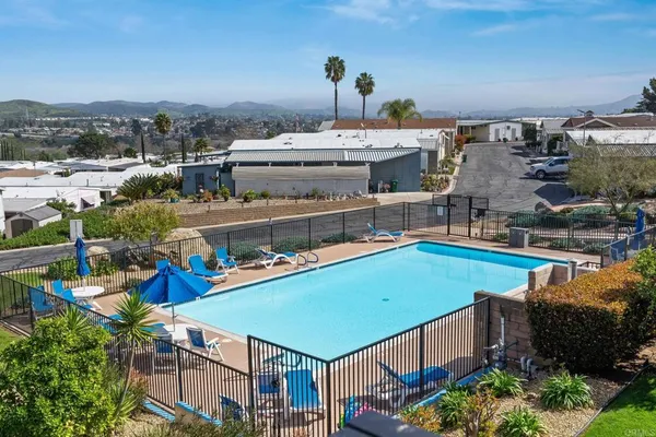 an aerial view of a house with a swimming pool