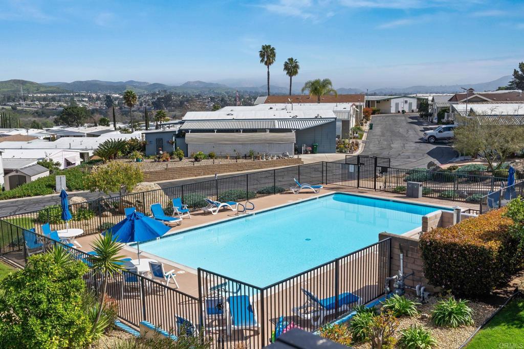 7467 Mission Gorge Road, Unit 104 Santee, CA 92071 - Photo 22 of 25 an aerial view of a house with a swimming pool