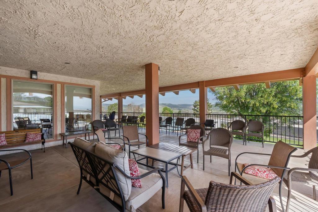 7467 Mission Gorge Road, Unit 104 Santee, CA 92071 - Photo 23 of 25 a living room with furniture and a large window