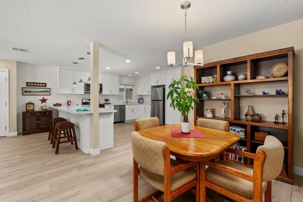 a dining room with furniture and window