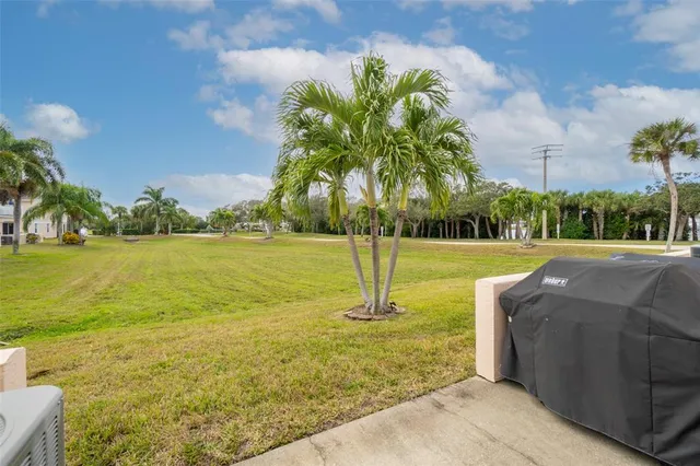 a bedroom with bed and a chandelier