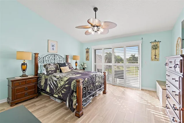 a view of staircase with wooden floor and white walls
