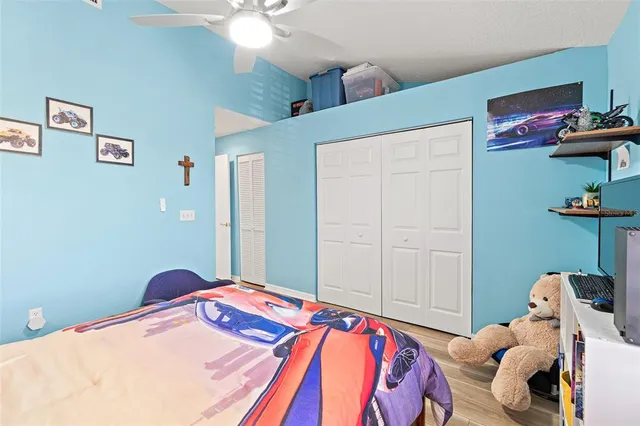 a view of a dining room with furniture a chandelier and wooden floor