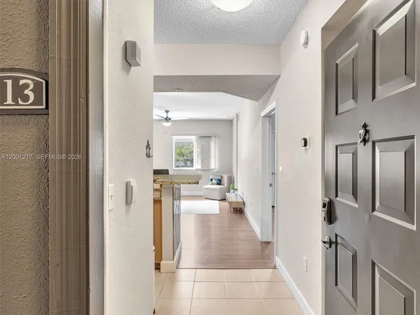 a kitchen with granite countertop cabinets stainless steel appliances and a sink