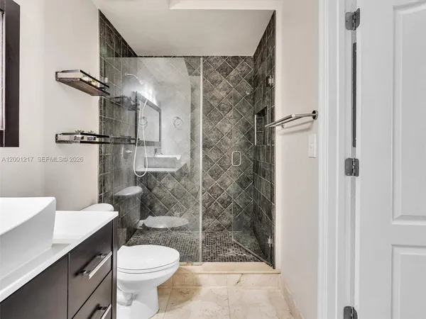 a view of a patio with a table and chairs and couches