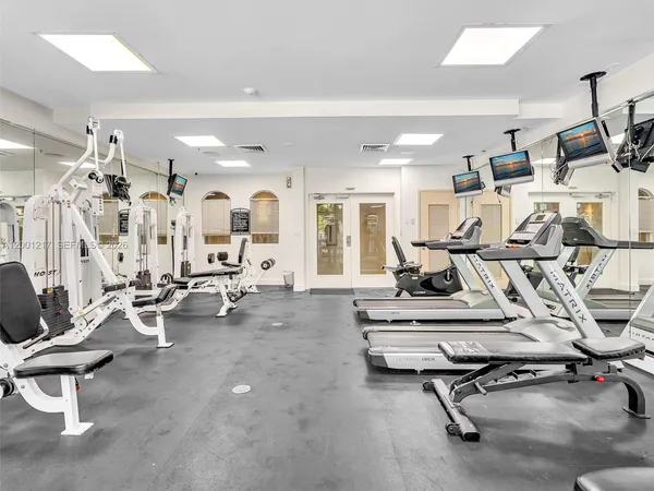 a view of a livingroom with furniture and a potted plant