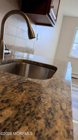 a view of hallway with wooden floor