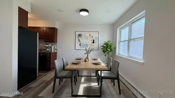 a kitchen with granite countertop a refrigerator and a sink