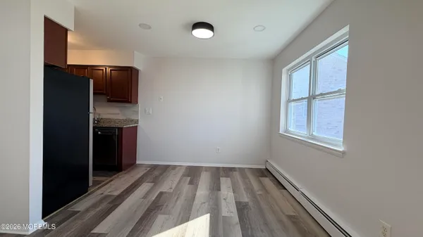 a stove top oven sitting inside of a kitchen