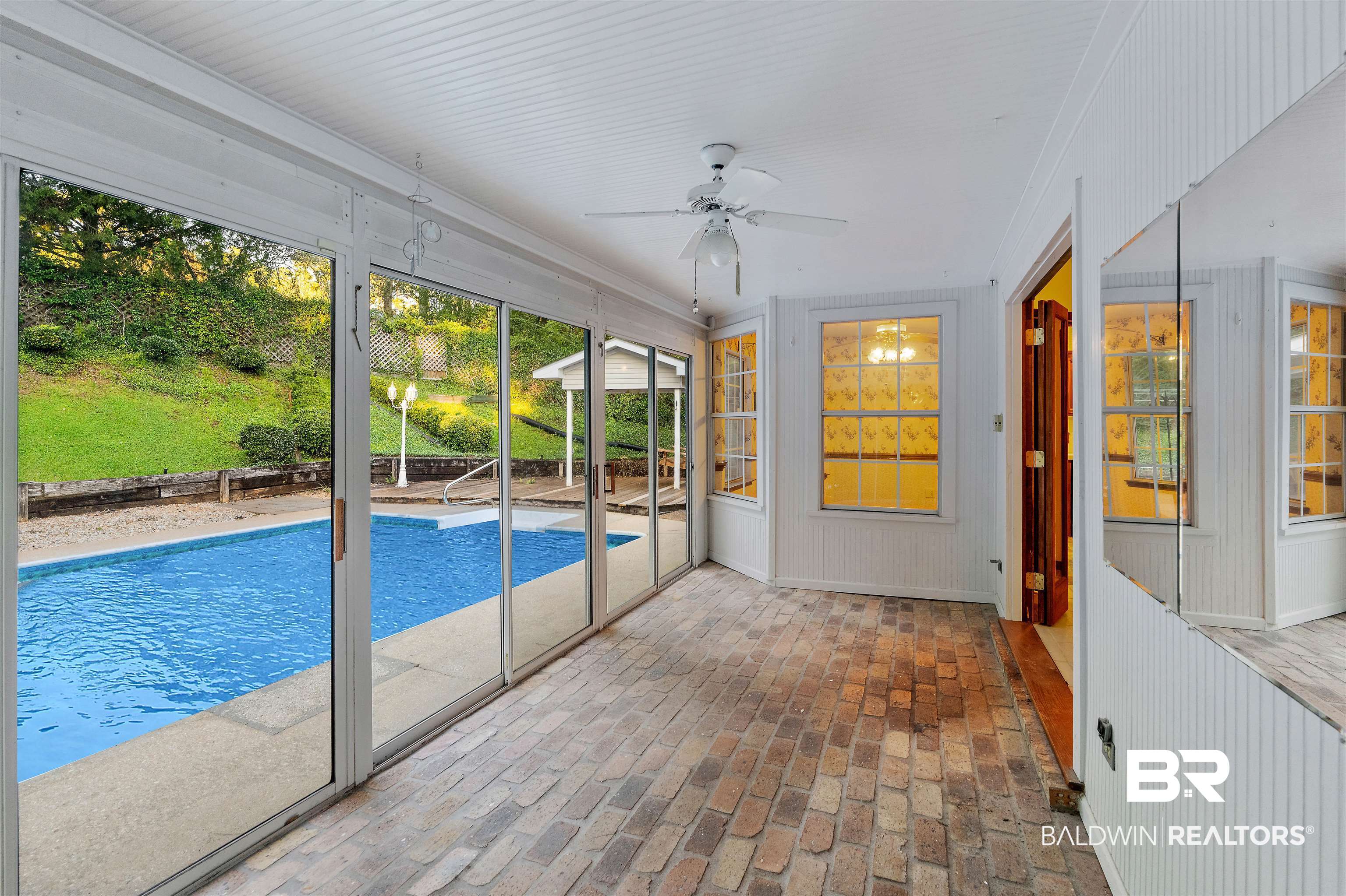 438 Ridgewood Drive Daphne, AL 36526 - Photo 20 of 28 Unfurnished sunroom featuring ceiling fan