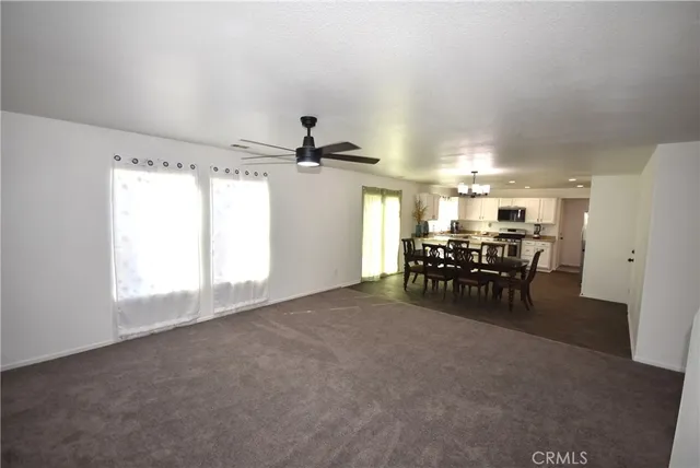 a view of a room with furniture and a window