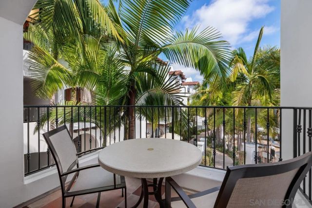 a view of a chairs and table on the deck
