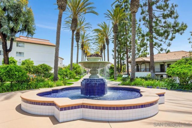 a view of a swimming pool with a yard