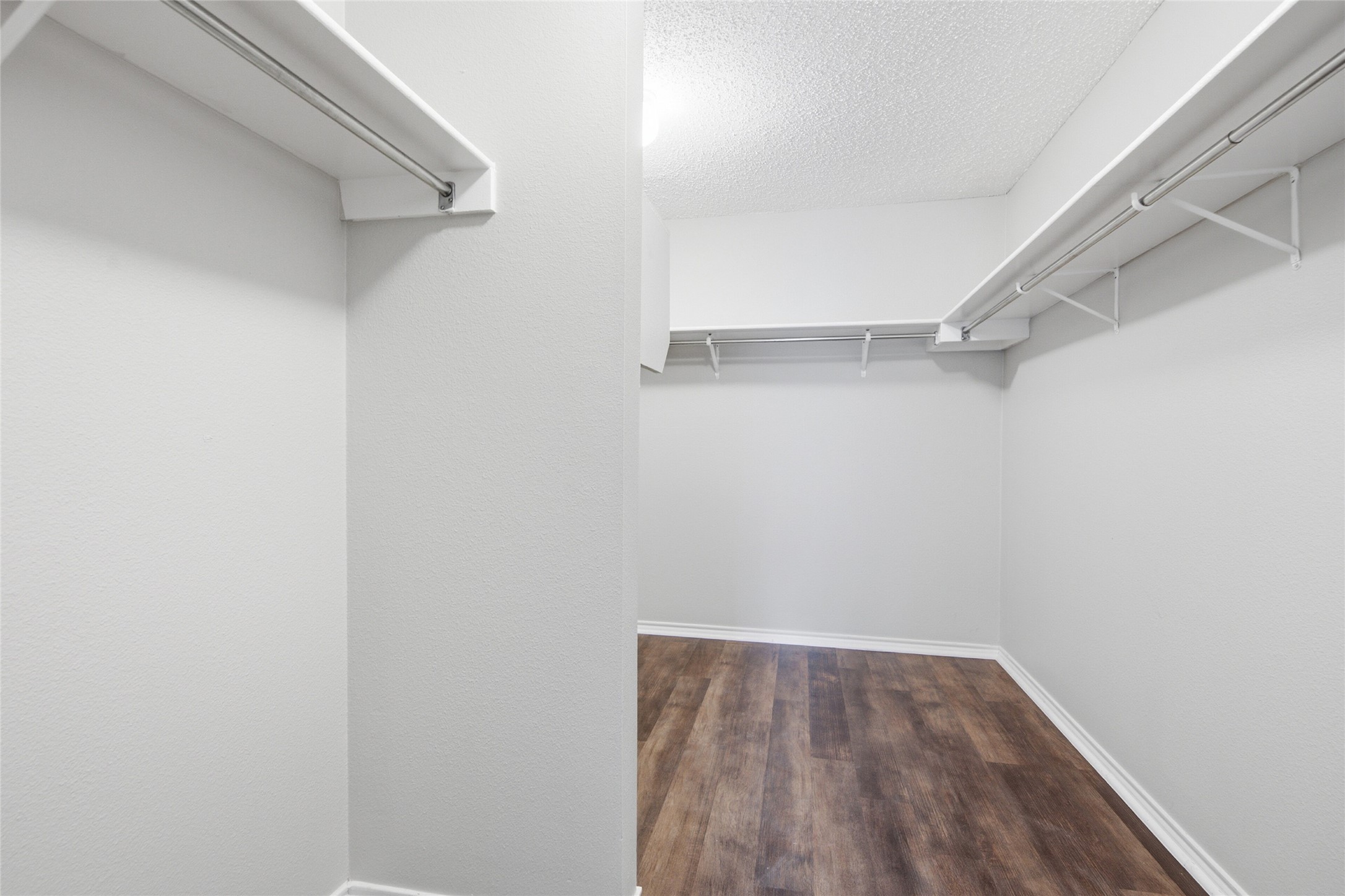 7900 Rosenberry Drive Austin, TX 78747 - Photo 21 of 27 Ample storage solutions define this spacious walk-in closet, ready to organize any wardrobe.