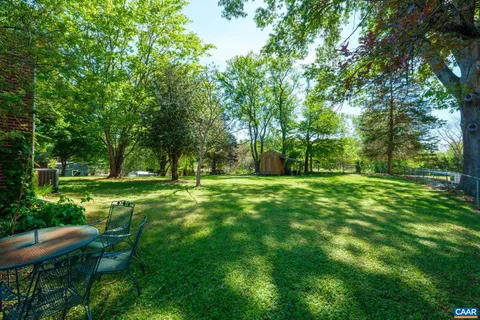 a view of green field with trees