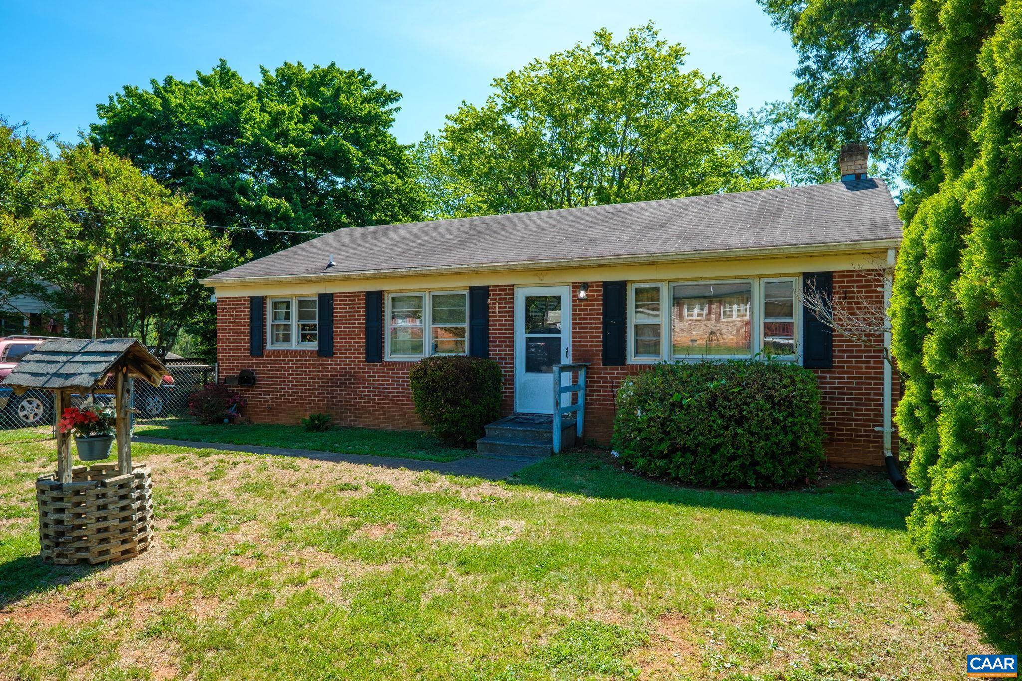 374 Locust Lane Ruckersville, VA 22968 - Photo 2 of 28 a front view of a house with garden