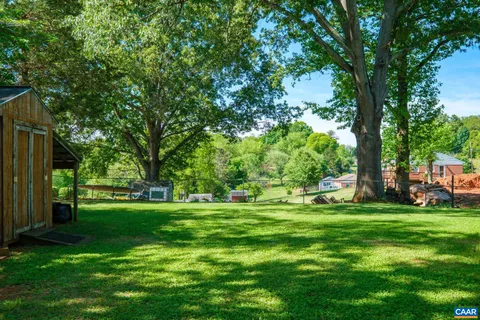 a view of a park with large trees