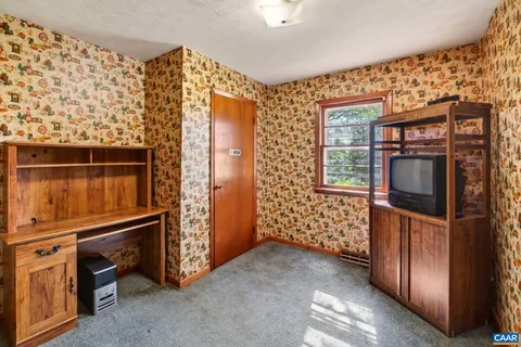 a view of empty room with windows