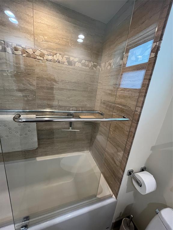 333 Northeast 21st Avenue, Unit 318 Deerfield Beach, FL 33441 - Photo 11 of 40 a bathroom with a shower