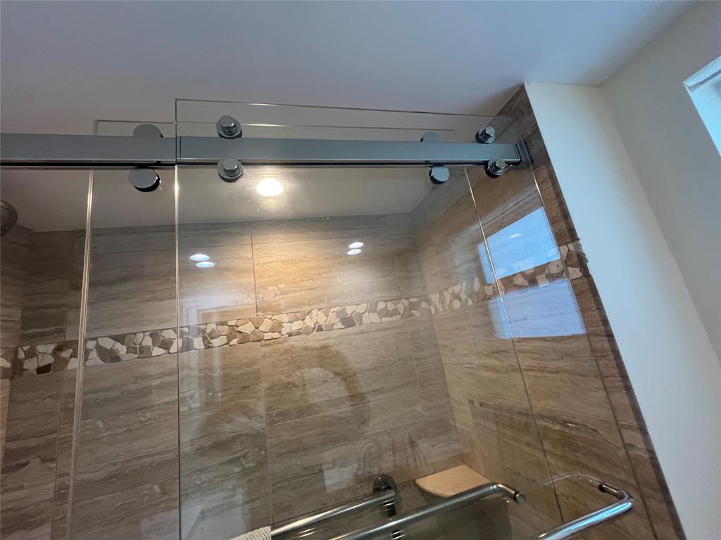 333 Northeast 21st Avenue, Unit 318 Deerfield Beach, FL 33441 - Photo 12 of 40 a bathroom with a shower