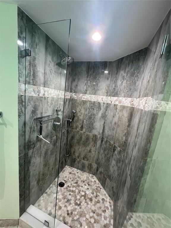 333 Northeast 21st Avenue, Unit 318 Deerfield Beach, FL 33441 - Photo 15 of 40 a bathroom with a shower