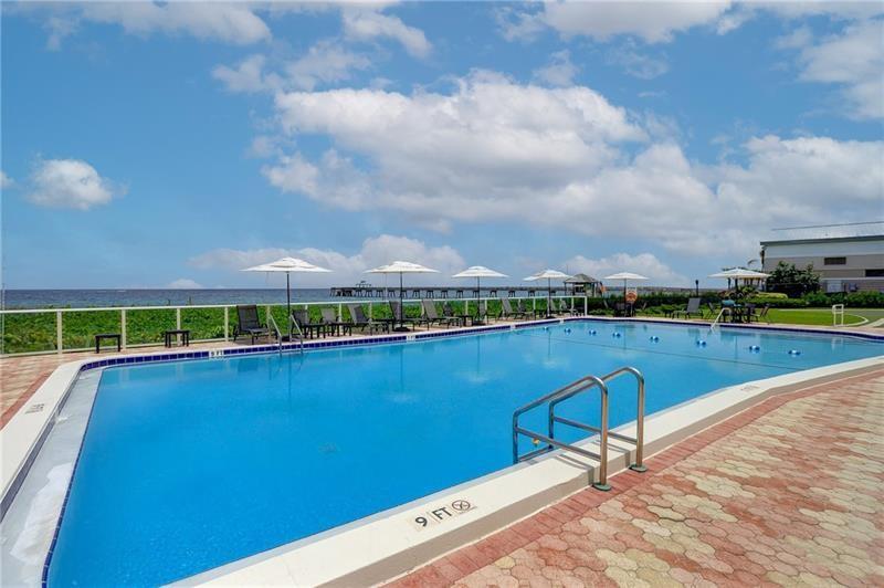 333 Northeast 21st Avenue, Unit 318 Deerfield Beach, FL 33441 - Photo 19 of 40 a view of a lake with houses