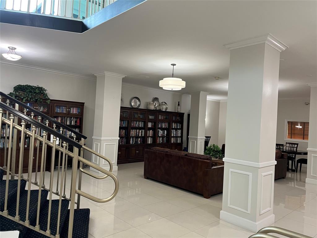 333 Northeast 21st Avenue, Unit 318 Deerfield Beach, FL 33441 - Photo 29 of 40 a view of a livingroom with furniture and staircase