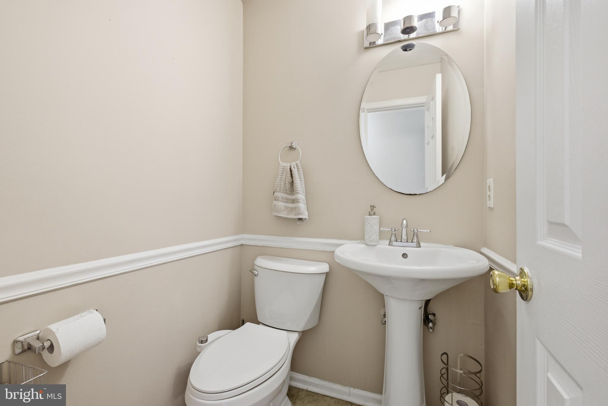 8664 Pohick Forest Court Springfield, VA 22153 - Photo 14 of 41 a bathroom with a sink mirror and toilet