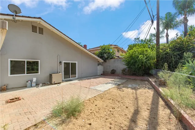 a view of a backyard of the house