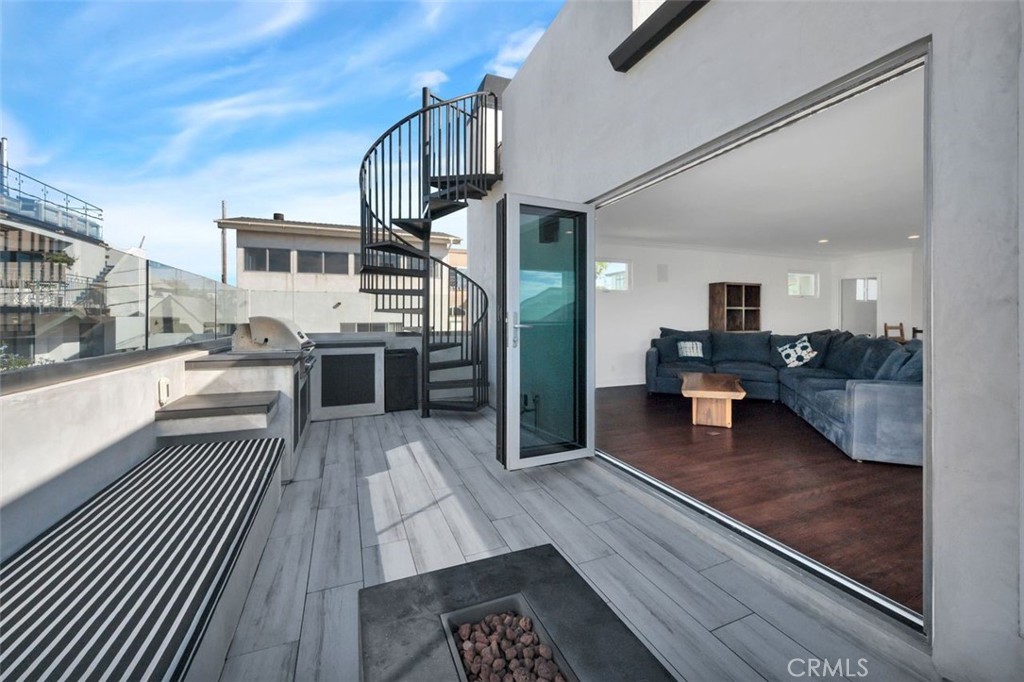 225 33rd Street Hermosa Beach, CA 90254 - Photo 12 of 37 a view of a living room kitchen and a wooden floor