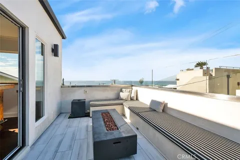 a view of roof deck with patio