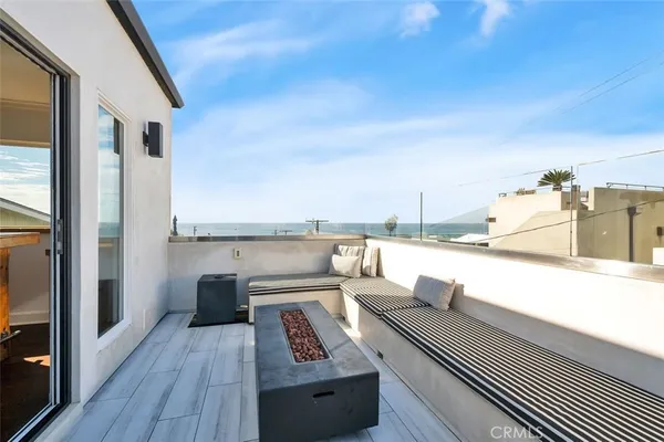 a view of roof deck with patio