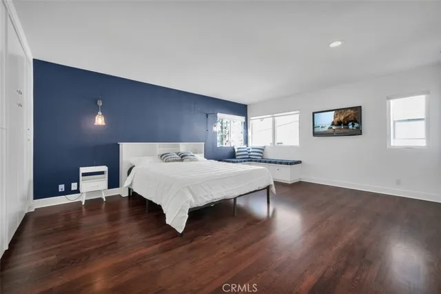 a large white bed in a white room