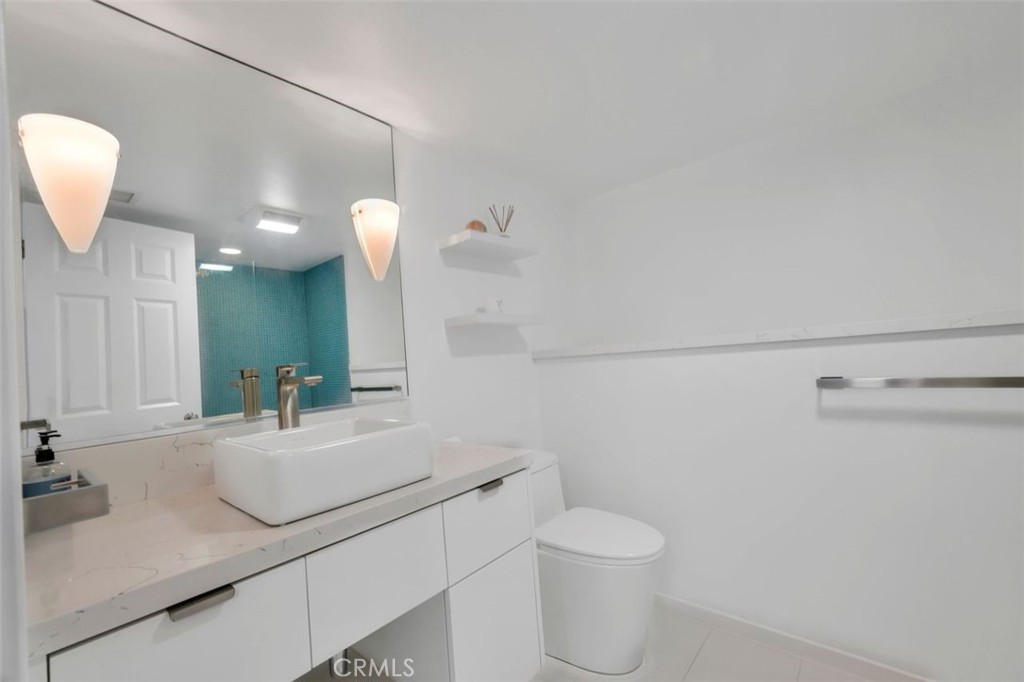 225 33rd Street Hermosa Beach, CA 90254 - Photo 35 of 37 a bathroom with a sink vanity granite and toilet