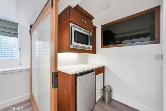a kitchen with a sink and a microwave