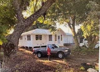 a view of a car in front of a house