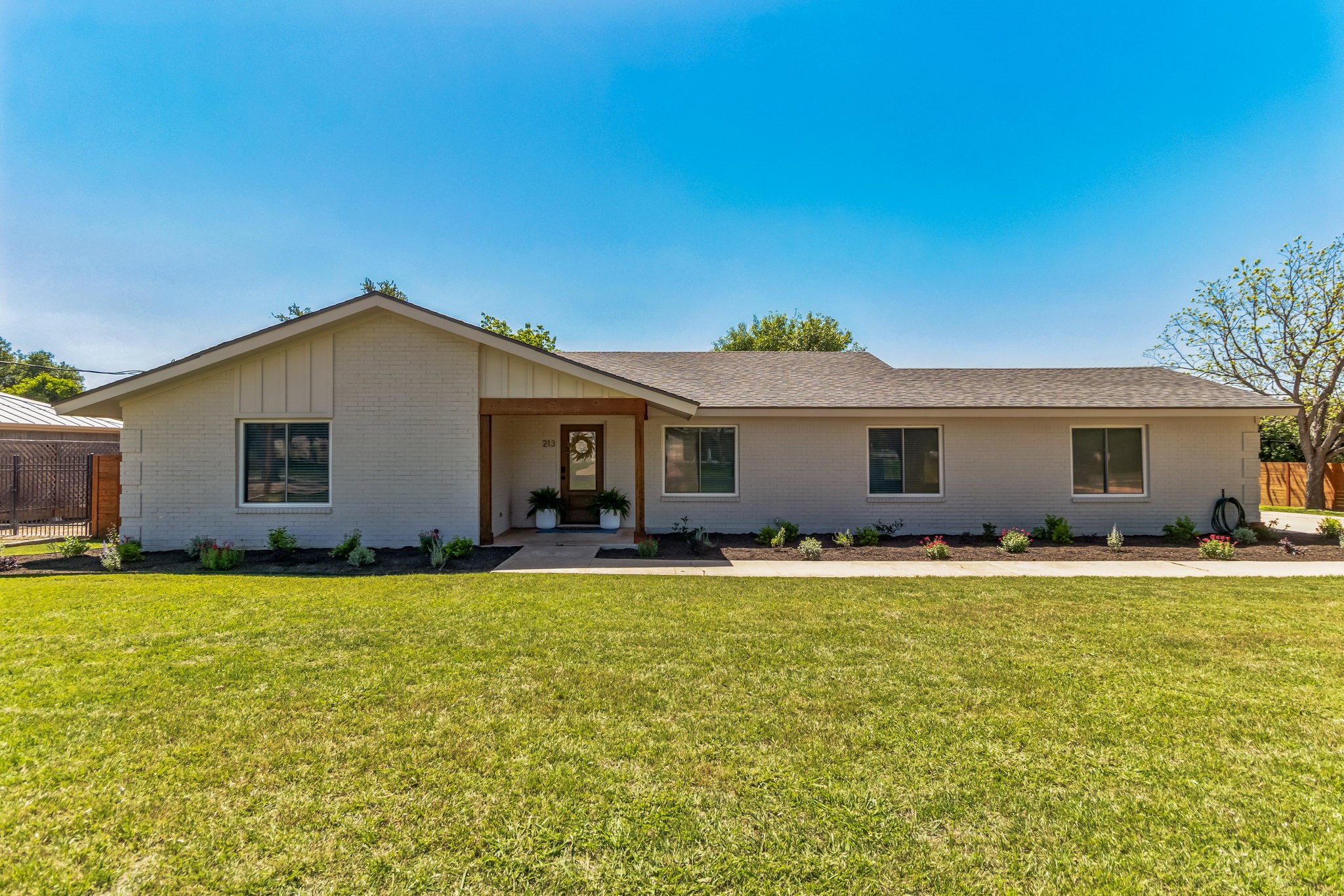 213 Clear Springs Road Georgetown, TX 78628 - Photo 3 of 33 Large 1/3 Acre Lot Making for Large Front and Backyards (mulch changed to river rock)