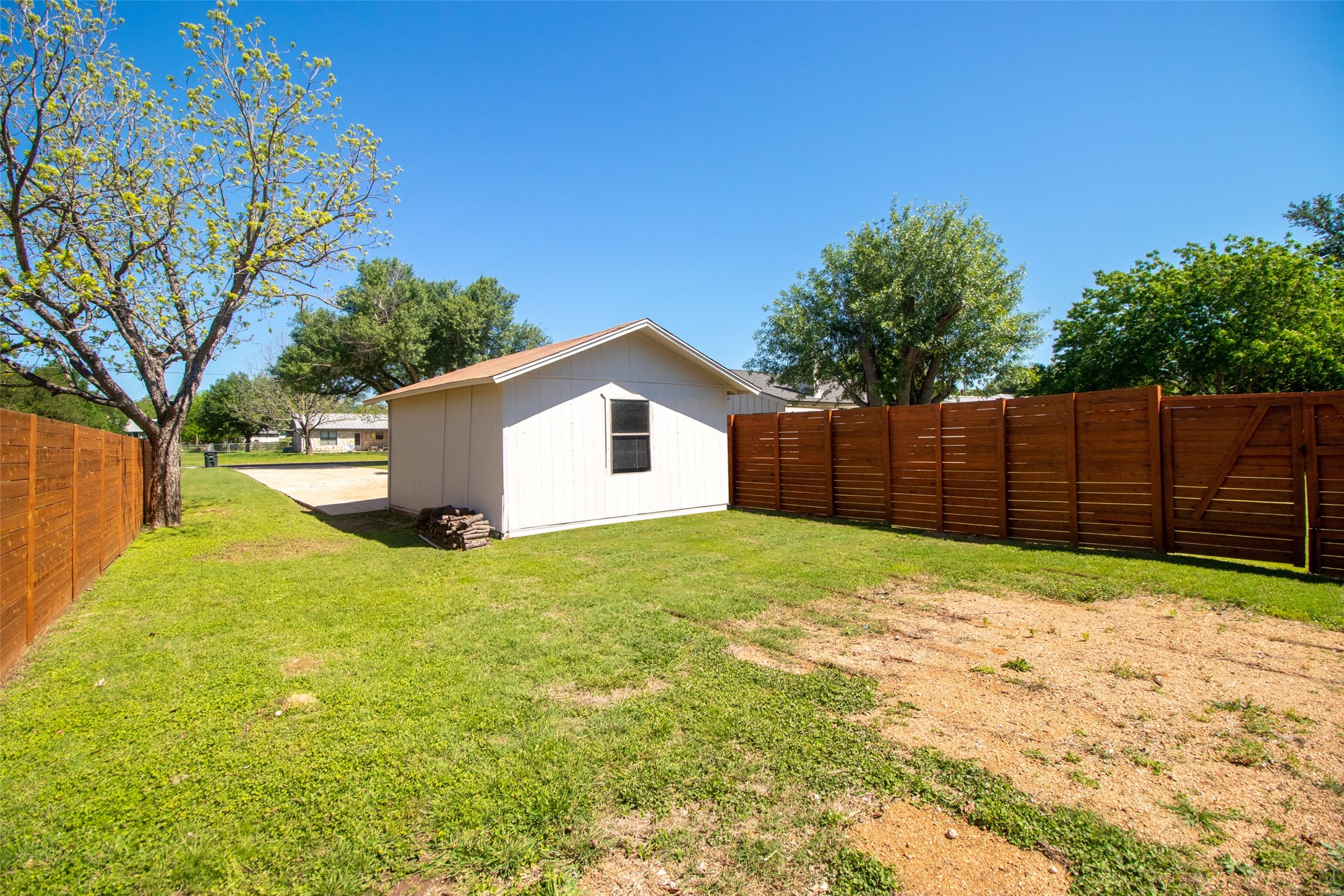 213 Clear Springs Road Georgetown, TX 78628 - Photo 31 of 33 Extra Space Behind Shed for RV, Equipment, Etc with Double Gate Access to Backyard