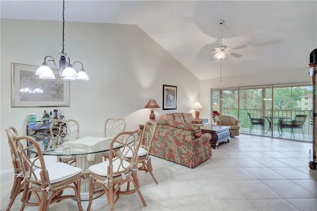 a living room with furniture a chandelier and a chandelier